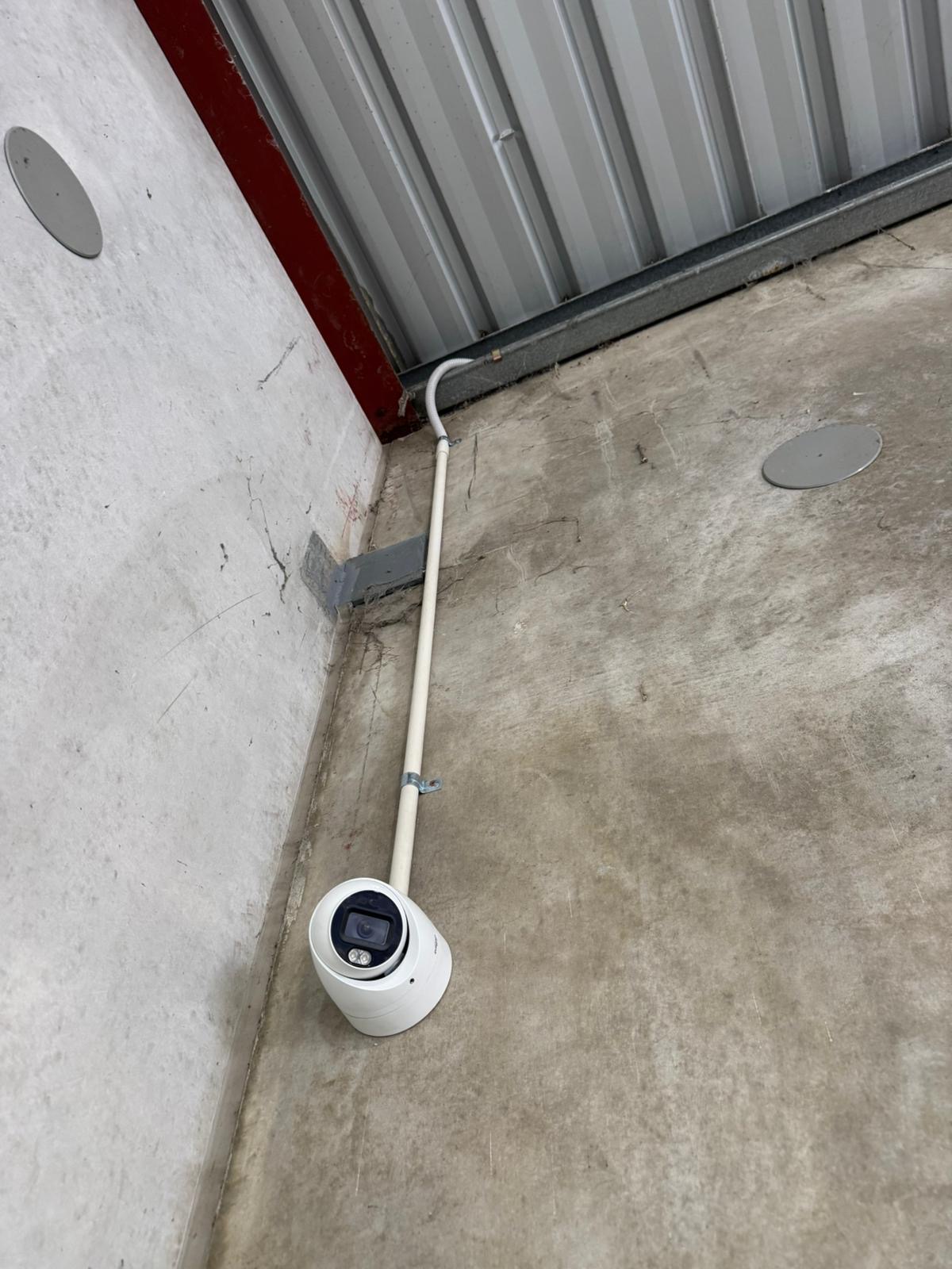 Exterior CCTV with clean conduit run · commercial